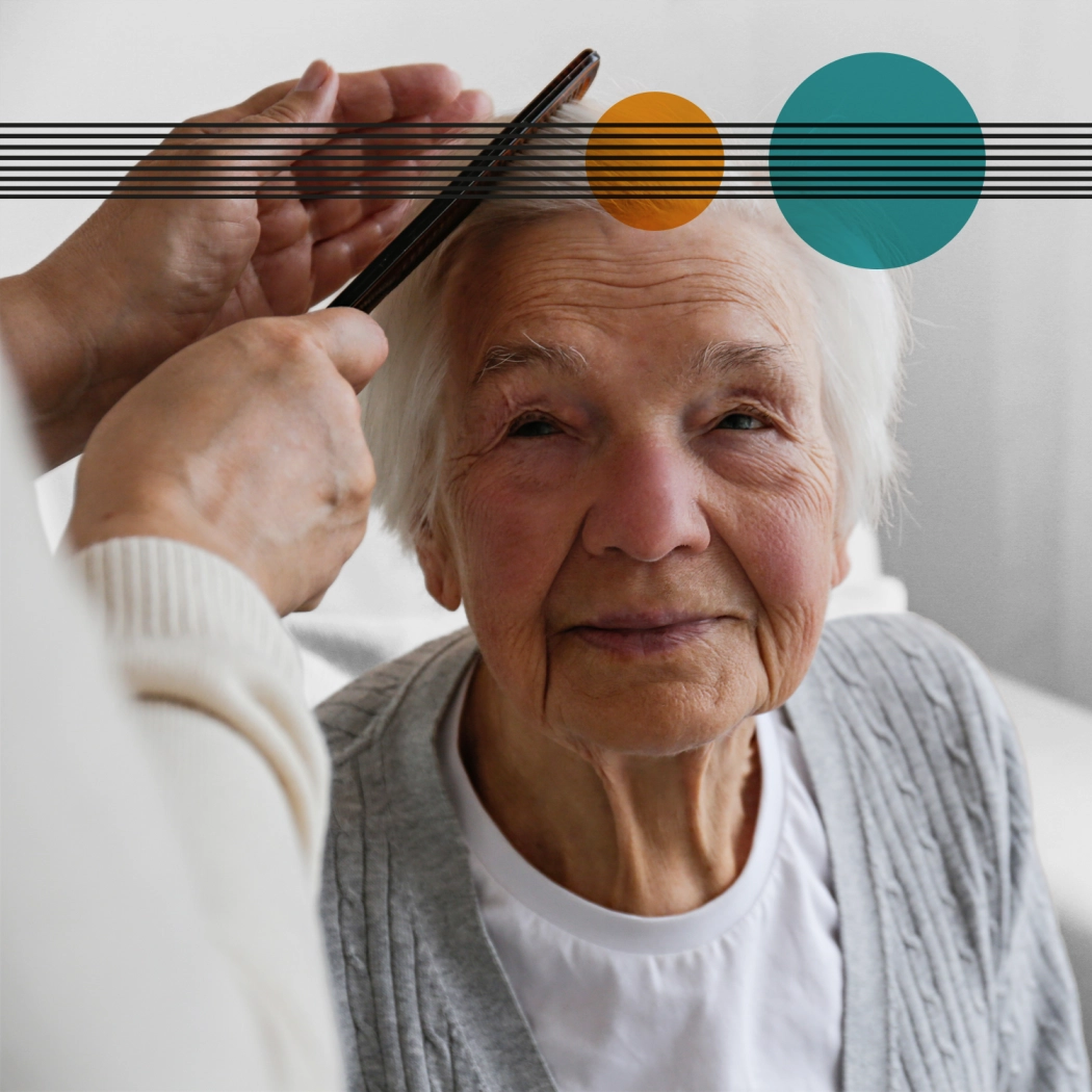 Elderly lady having her hair brushed